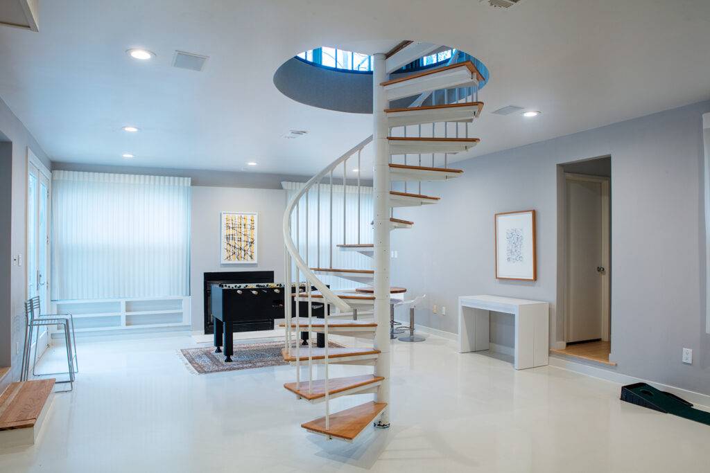 This is a polished white concrete overlay installed in a high-traffic residential game room. It’s easy to love how modern and bright this floor is—and because its polished concrete, overlays are nearly indestructible and maintenance free.
