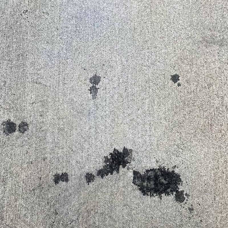 Oil stained concrete driveway