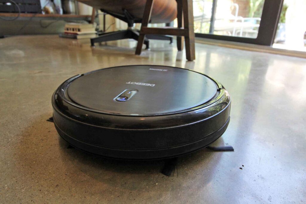 A robotic vacuum-cleaning a polished concrete floor. We recommend robotic vacuums for daily floor maintenance. 